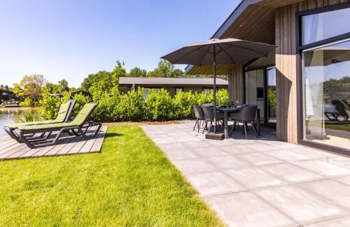 Municipality of Veldhoven Ski Chalet | Chalet by Pond with Sauna