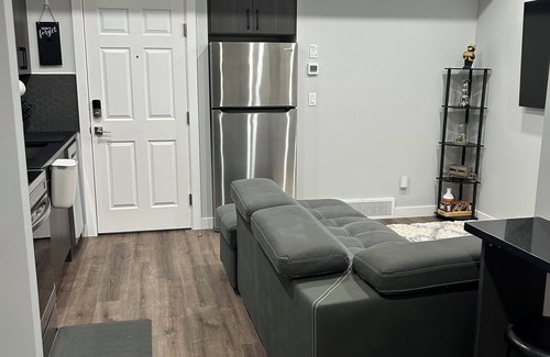 Calgary House | Charming 1-Bedroom Basement Walkout Suite with a Gym and Office.
