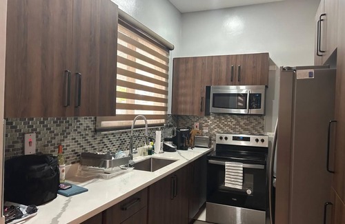 Saint Andrew Apartment | Charming 2-bedroom apartment with pool, AC, parking and WiFi in Kingston
