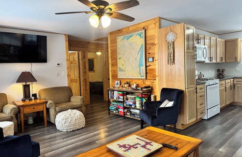 Birchwood House | Charming 2-bedroom cottage with WiFi, AC on quiet lake on trails with kayaks.
