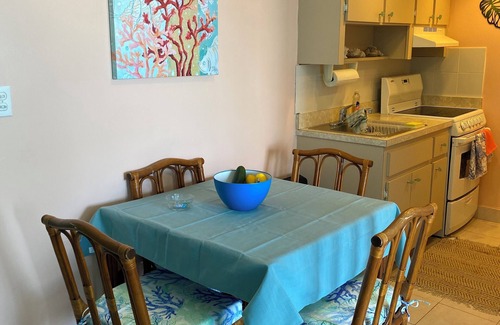 Discovery Bay Condo | Charming beach front condo, Freeport ,Coral Beach, with AC/WiFi, salon/spa, pool