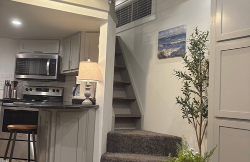 Conroe Cottage | Charming Tiny Home in Conroe with huge patio +grill & lots of green space.