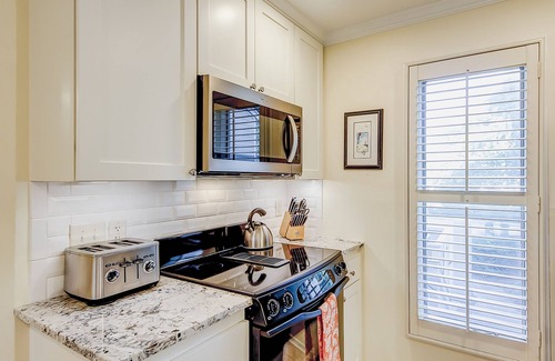 Isle of Palms Villa | Charming villa with pool, tennis, fireplace, fast WiFi, & washer/dryer