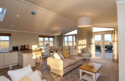 Briggswath Cottage | CHERRY BLOSSOM LODGE, pet friendly, with a garden in Whitby