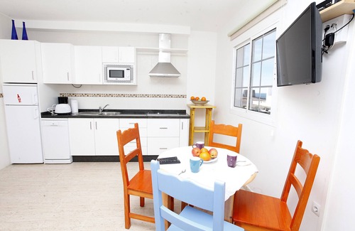 El Cotillo Apartment | Chic apartment with sea views on a sandy beach, large roof terrace and WiFi