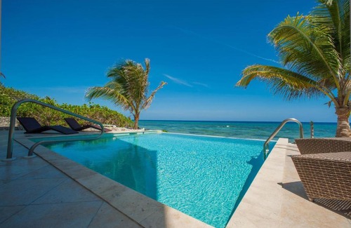 Old Man Bay House | Christmas Palms by Grand Cayman Villas & Condos