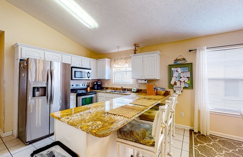 Panama City Beach Cottage | Colorful home near the beach with 2 pools, bikes, beach gear, W/D, & AC