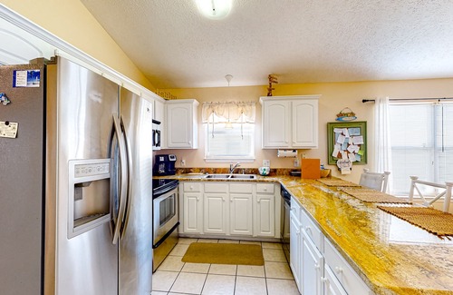 Panama City Beach Cottage | Colorful home near the beach with 2 pools, bikes, beach gear, W/D, & AC