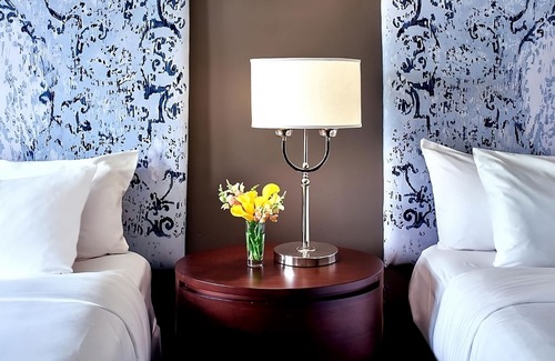 West Plaza Hotel | Comfort and Convenience! 2 Pleasant Units, Pool, Pets Allowed Near Crown Center!