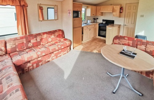 Narberth House | Comfortable and spacious 12ft-wide caravan with one double and two twin.