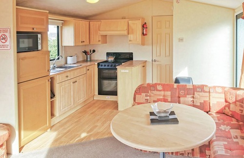 Narberth House | Comfortable and spacious 12ft-wide caravan with one double and two twin.