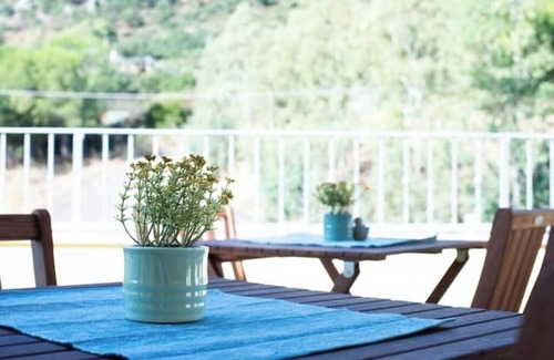 Guspini House | Comfortable room with private balcony and view