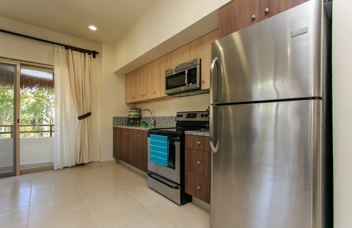 Zama Apartment | Condo Complex with an Alluring Pool & Tropical Vibes by Stella Rentals