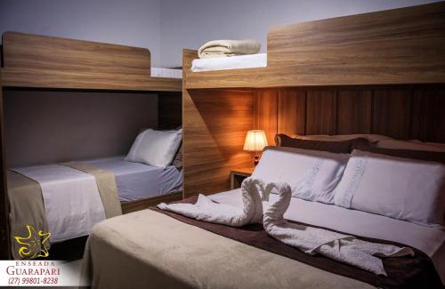 Praia do Morro Apartment | CONFORTO IMBATIVEL - 25 metros do MAR - 2 Quartos com AR CONDICIONADOS SPLIT, Air Fryer, WI-FI, Disney Plus, Star Plus, HBO Max, Guarda Sol, Cadeiras de Praia e Caixa Térmica - 8 pessoas com Muito Conforto - Melhor Localização!