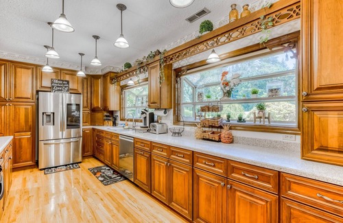 Boring House | Countryside home with private swim spa, fire pit, spacious kitchen, & game room