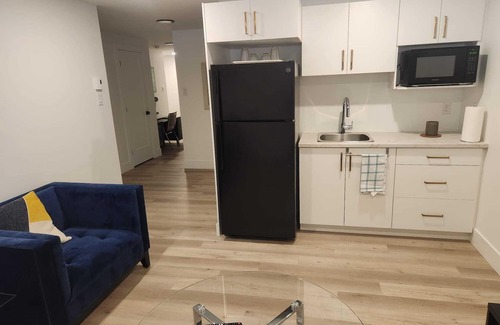 Dieppe House | Cozy Basement Apartment with Private Entrance and Office space-4 Mins to Airport