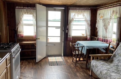 West Branch Cabin | Cozy Cabin at Water’s Edge: Sandy Beach, Kayaks, and Fun for the Whole Family
