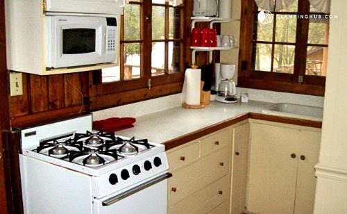 West Branch House | Cozy Cabin Rental with Stunning Lake Views in West Branch, Michigan