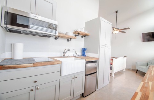 Uhland Cabin | Cozy cabin with queen bed, full kitchen, and refreshing walk-in shower.