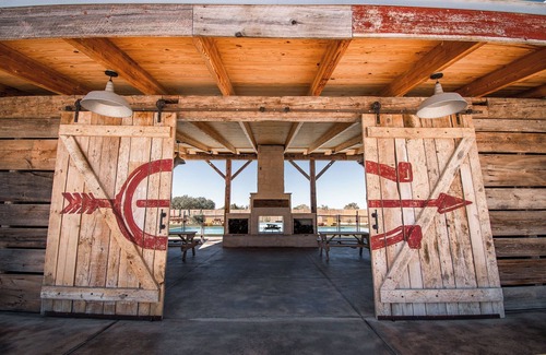 Uhland Cabin | Cozy cabin with queen bed, full kitchen, and refreshing walk-in shower.