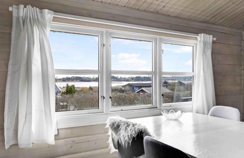 Kirke Saaby House | Cozy Log Cabin With A View Of The Water