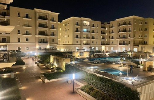 Sheraton Al Matar Apartment | Cozy Mivida Boulevard Flat Overlooking Pool