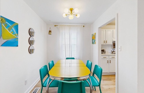 Beach Institute Apartment | Cozy retreat with shared outdoor dining area, modern comforts & reading nook