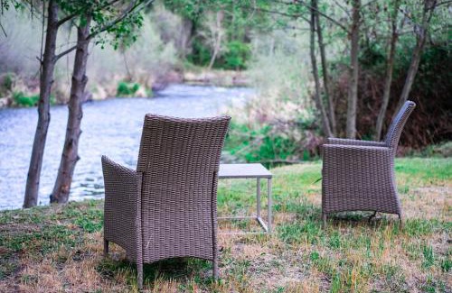 Murphy Other | Cozy Wild West Covered Wagon next to River