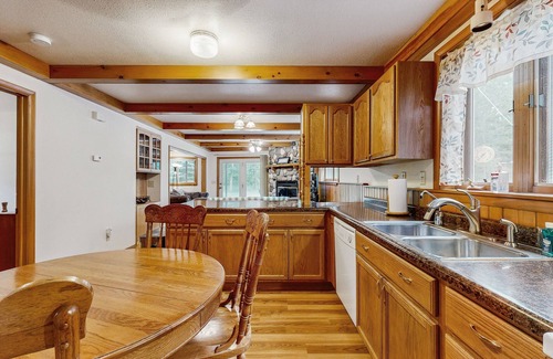 Friendship House | Cozy wooded duplex w/WiFi, full kitchen, shared W/D & near lakes & trails