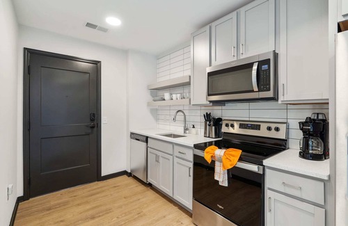 Lockerbie Square Apartment | CozySuites Mass w/parking, lounge & roof deck #14