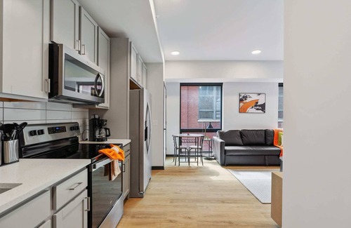 Lockerbie Square Apartment | CozySuites Mass w/parking, lounge & roof deck #14