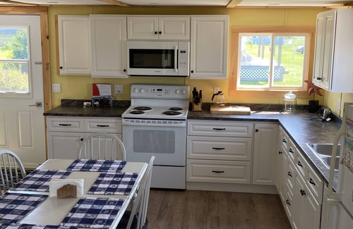 Victoria Cottage | Cute cottage with water view. Steps to a red sand beach on the South Shore.