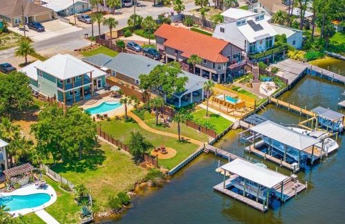 Holiday Beach House | Dancin on the Waves On Lagoon Boat dock, Pool, Firepit