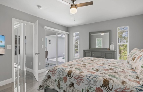 Pelican House | Deja Blue Villa | Canal Front + Screened-In Private Heated Pool