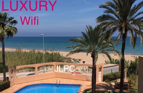 Denia Apartment | DENIA-APT IN FRONT OF THE SEA DIRECT ACCESS TO THE SANDY BEACH-WIFI-POOL-POOL-GARDEN-PARKING