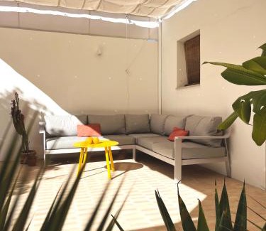 Carrion De Los Cespedes Apartment | Design & art, patio with orange tree, near Seville