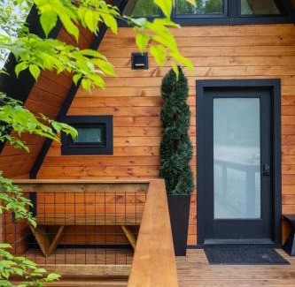 Johnson House | Designer A-Frame Treehouse with hot tub on river