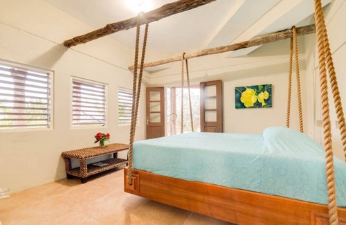 Robins Bay Villa | Discounted Private White Sand Beach. Intimate, Romantic Swinging King Size Bed