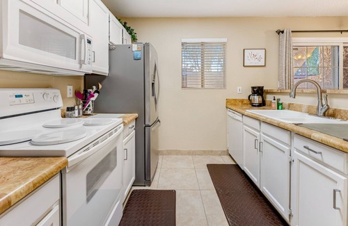 Dobson Ranch Condo | Dog-friendly condo with enclosed patio, pool, hot tub, & W/D - snowbirds OK