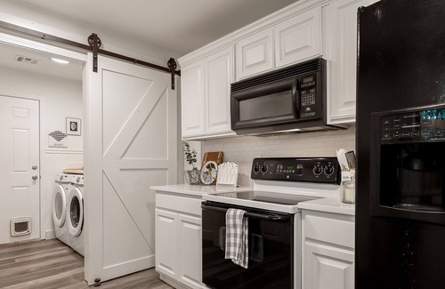 Bella Vista House | Dog-friendly home with wooded views, fireplace, W/D & classic front porch