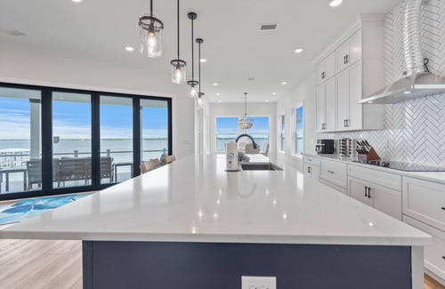 Caribbean Isle House | Dolphin Cove-Luxury Soundfront retreat w/private pier. 6 bed/6.5 bath sleeps 16