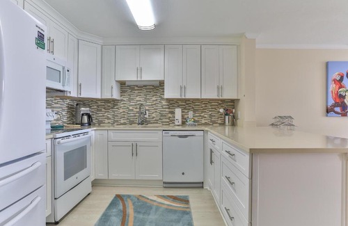 Holiday Isle House | Dolphin Point 402C - 2BR Updated Condo with Harbor and Gulf Views