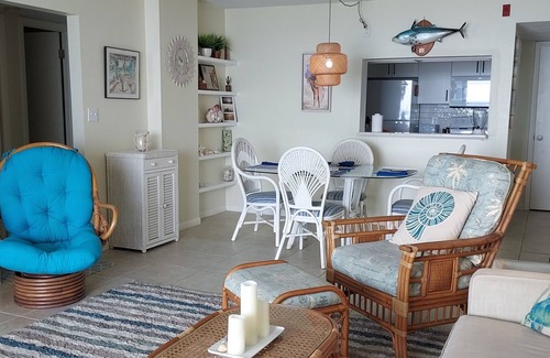 East Wind South Condo | Dolphin View-oceanfront condo with large balcony overlooking no drive beach.