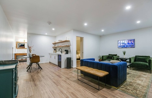 San Angelo Hotel | Elegant Suite with Separate Living Room & Mini Fridge – Ideal for Relaxation and
