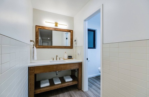 San Angelo Hotel | Elegant Suite with Separate Living Room & Mini Fridge – Ideal for Relaxation and