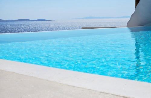 Agios Stefanos Apartment | ELLI TROPiCAL LUXURY SUITES SUNSET-INFINITY POOL- SEA SIDE-NEAR CENTER PARKING