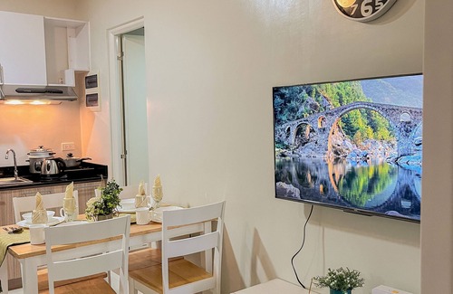 Puerto Princesa City Centre Apartment | Emerald 2 bedroom apartment with a pool, gym, and a balcony with a view