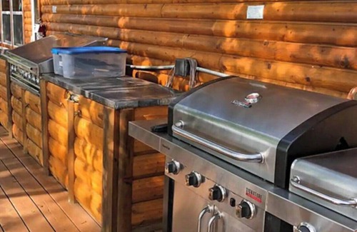 Rice Lake Ski Chalet | Enjoy a quiet stay on your own private deck by the lake in Room 21: Ponderosa-a Western Themed Chalet