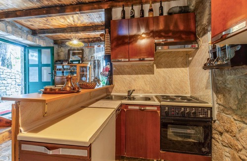 Vrgorac House | Enjoy a wonderful view of the countryside from this inviting vacation home with pool access.