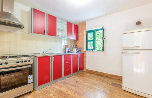 Vrgorac House | Enjoy a wonderful view of the countryside from this inviting vacation home with pool access.